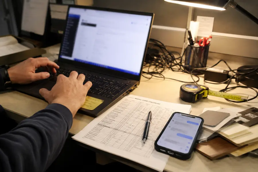 Phone photo of customer support checking product model details